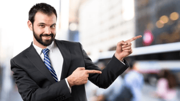 man-pointing-sales-marketing-business-suit