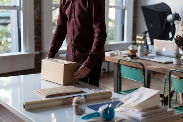 Man preparing to open online delivery package